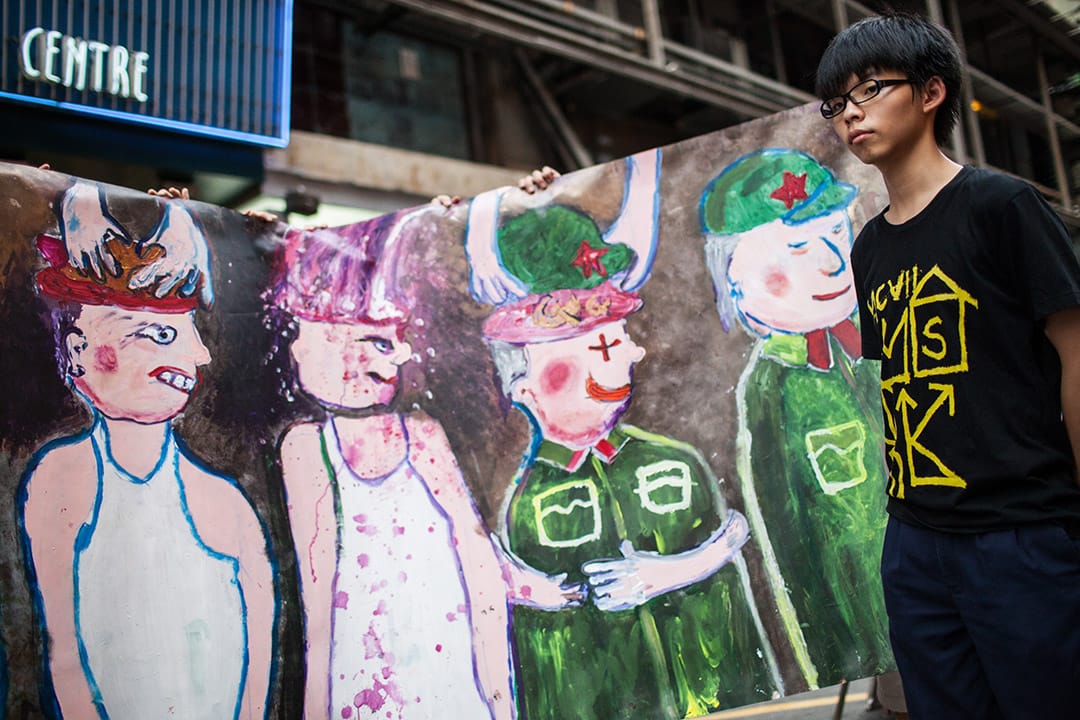 2012年,學民思潮於旺角行人專用區舉行反國民教育洗腦活動。攝:林亦非/端傳媒